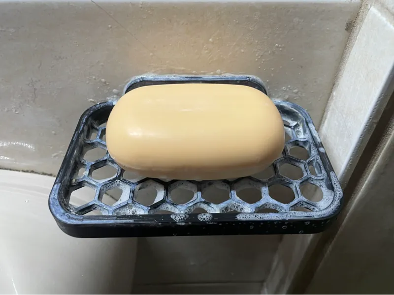 Soap holder with wall mounting hole