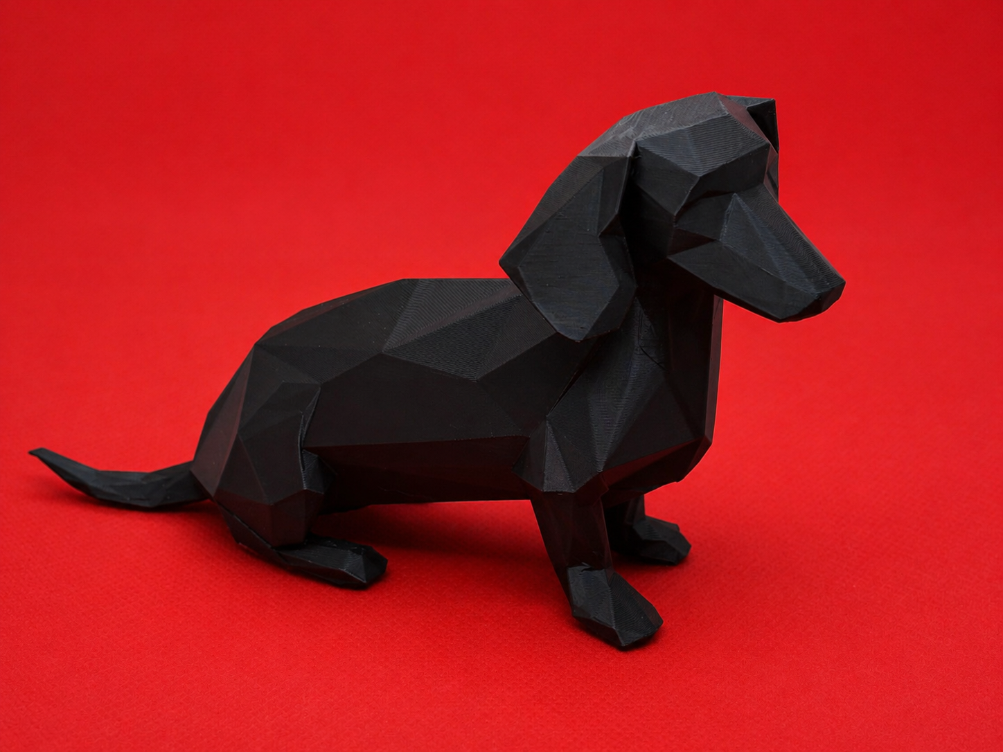 Low-poly sitting daschund