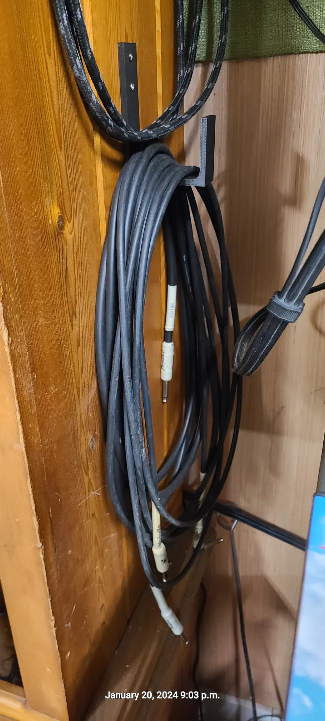 Wall mount cord hanger