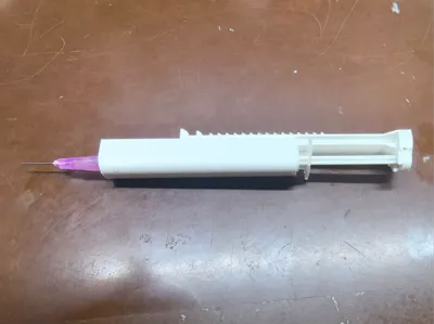 Syringe-assisted extruder