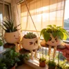 Cute winking face swinging flower pot