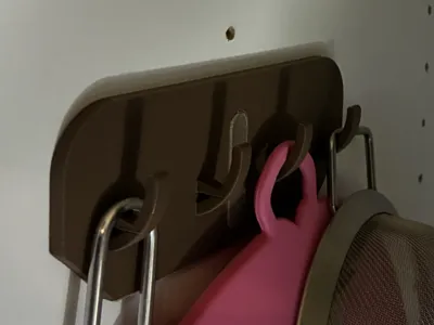 Hanger for inside cabinets to mount in holes