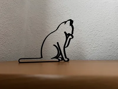 Cat silhouette sitting - licking paw
