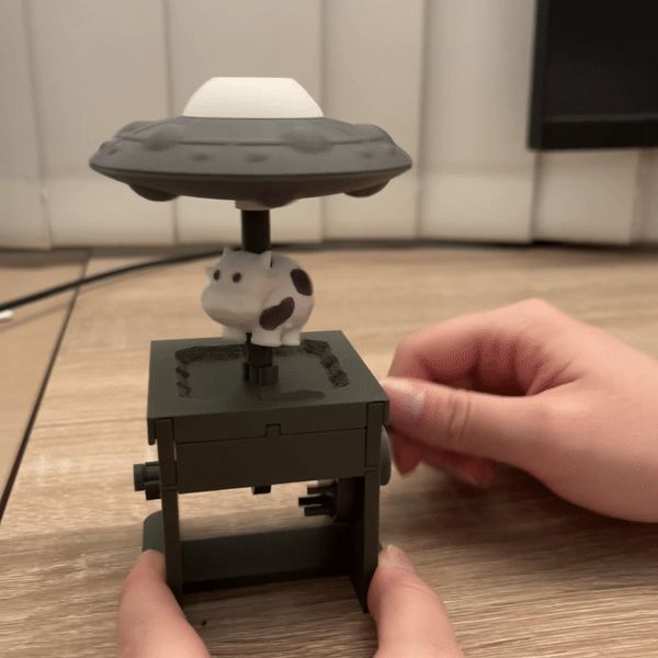 UFO Automata (Flying sauce abducting cow mechanical toy)