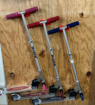 Wall mounted razor scooter holder