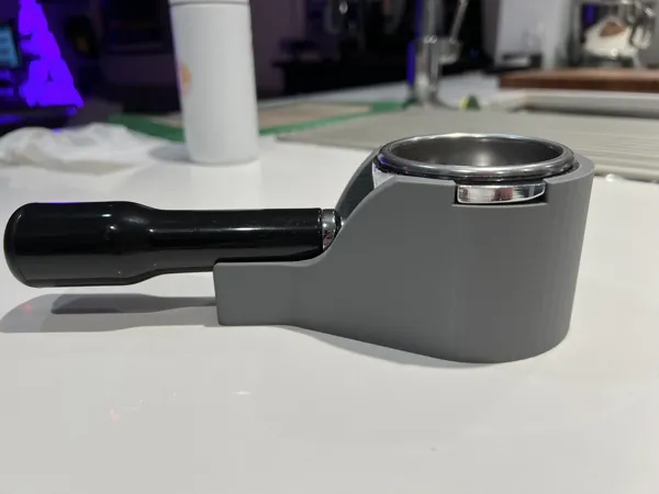 Station de tamping pour portafiltre sans fond
