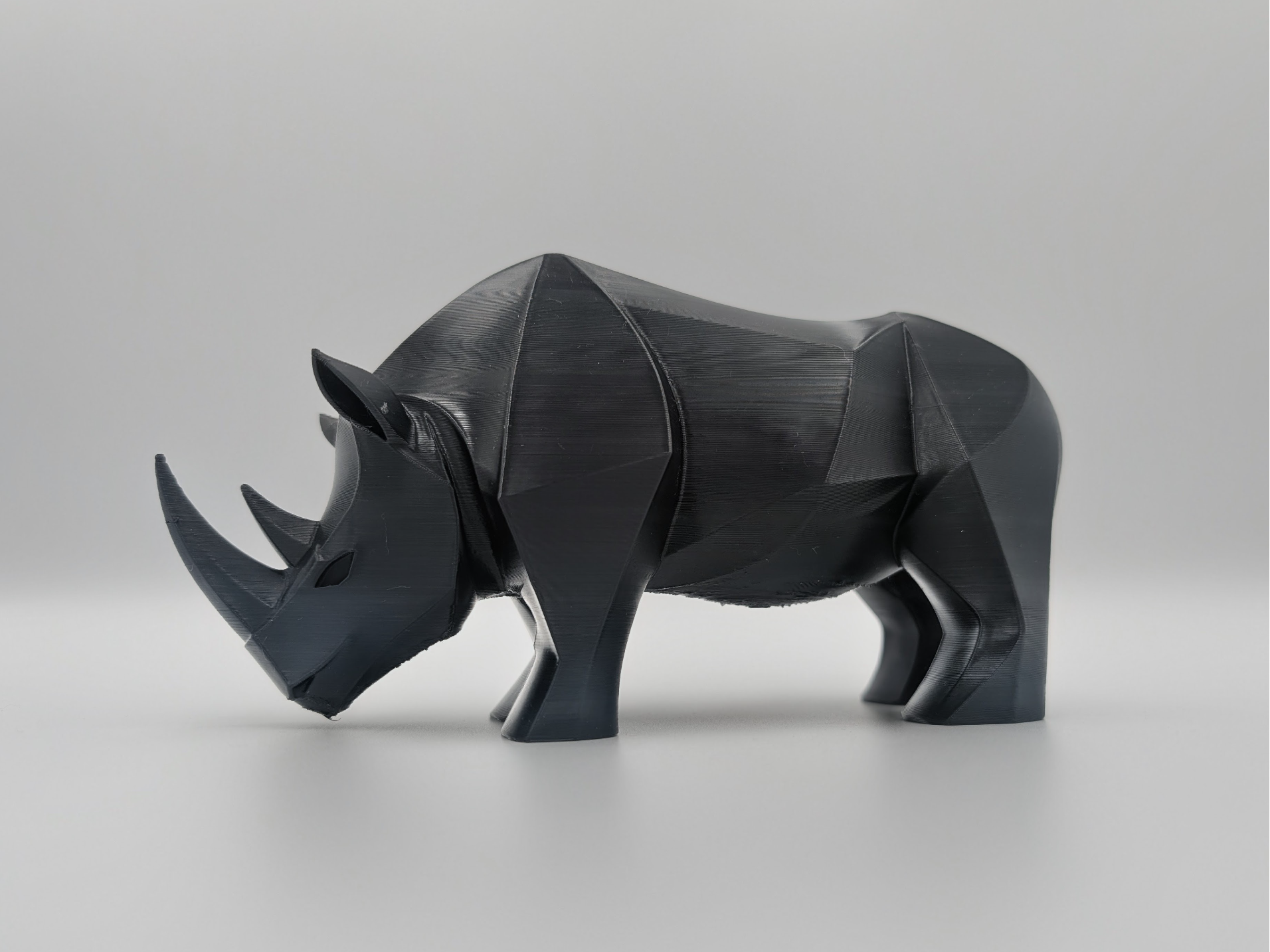 Geo Rhino Sculpture – Modern Animal Art Piece