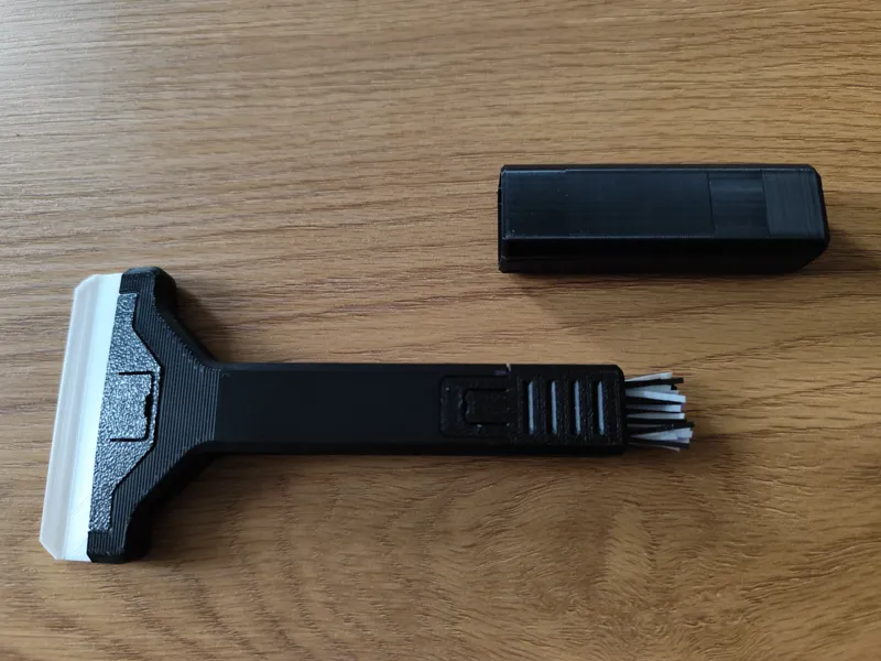 Scraper multitool with brush