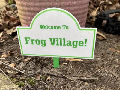 Frog Village Sign