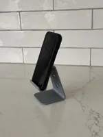 Holds phones with a case