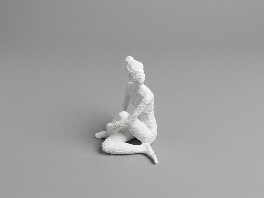 Faceless Sculpture Sitting