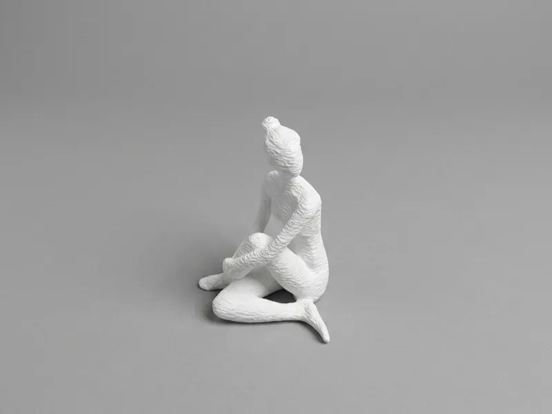 Faceless Sculpture Sitting
