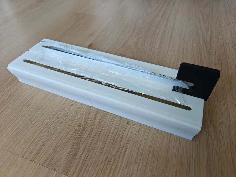 Modular cling/aluminium foil holder with cutter