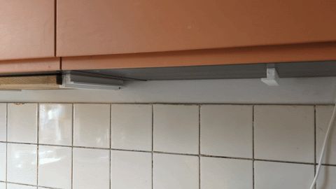 Under cabinet cutting board storage