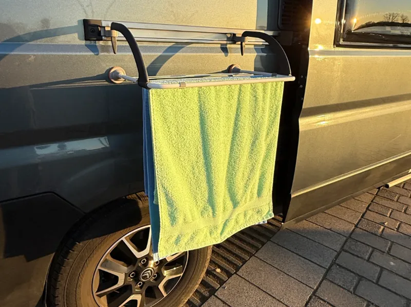 Clothesline holder for RV