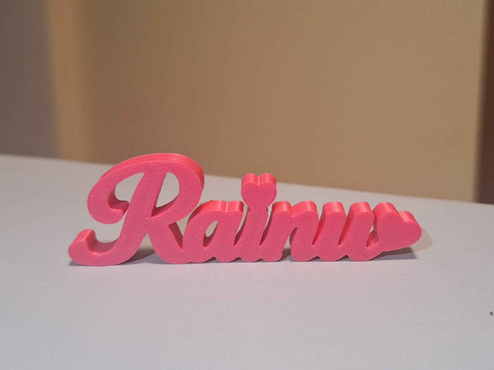 Rainu, scritta da appoggio con nome