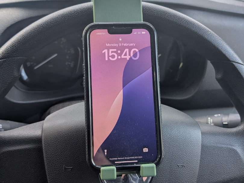 Phone holder for steering wheel.