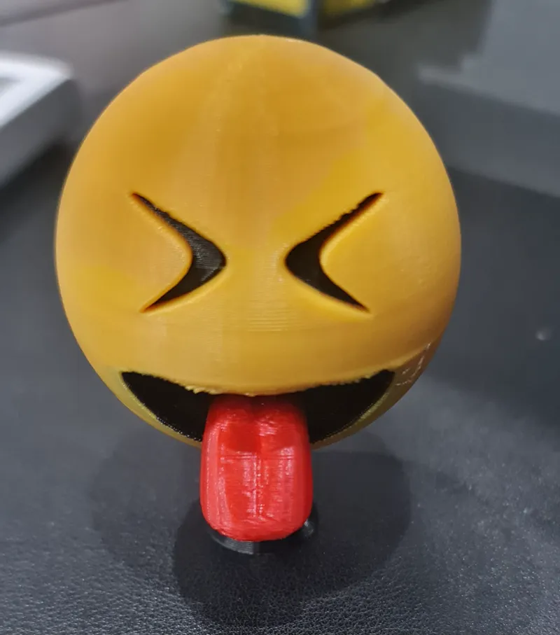 Squinting face with tongue