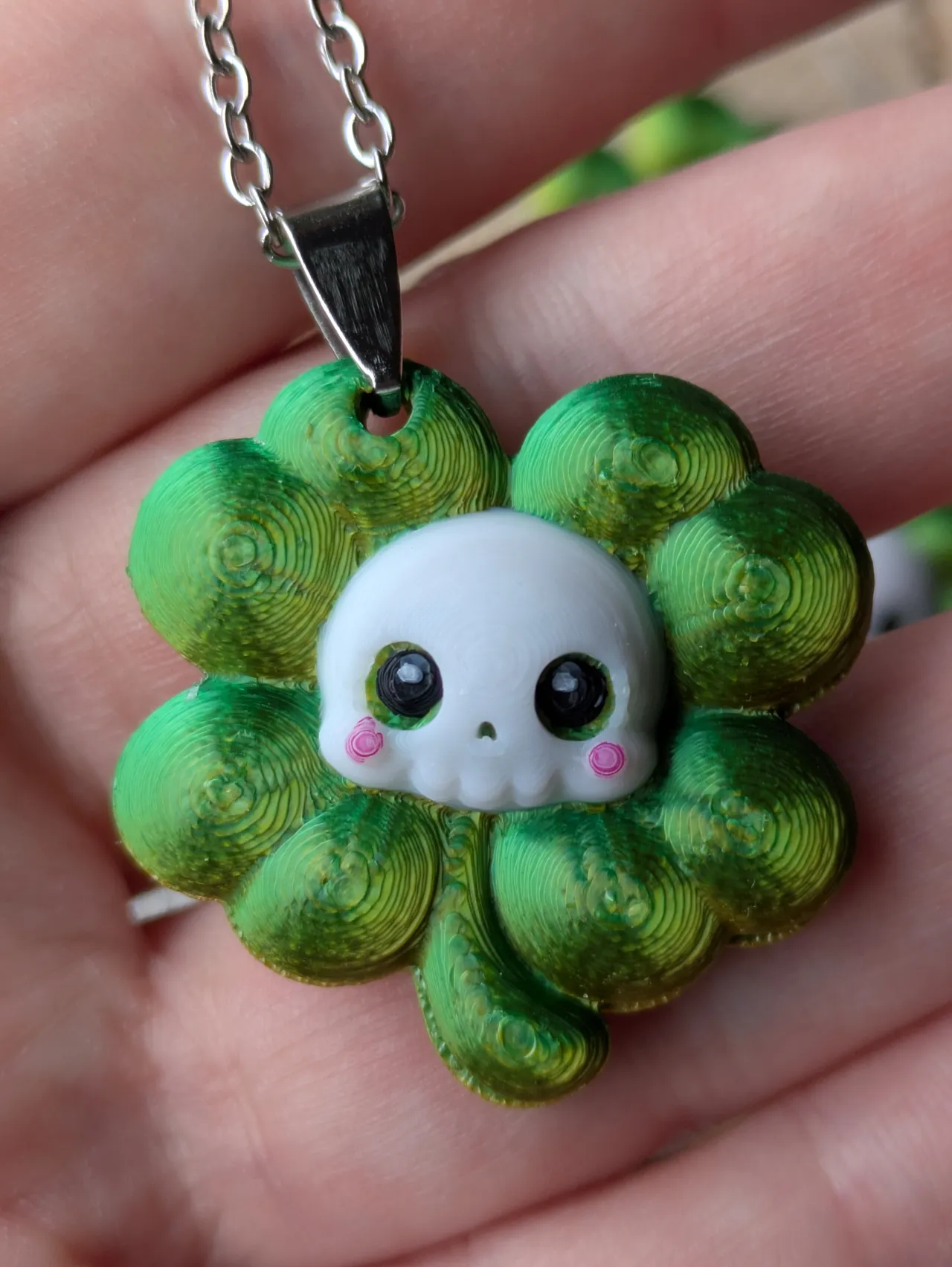 Chibi skull clover earrings, necklace, keychain view 3