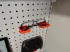 A set of spectacle stands and a headphone hook