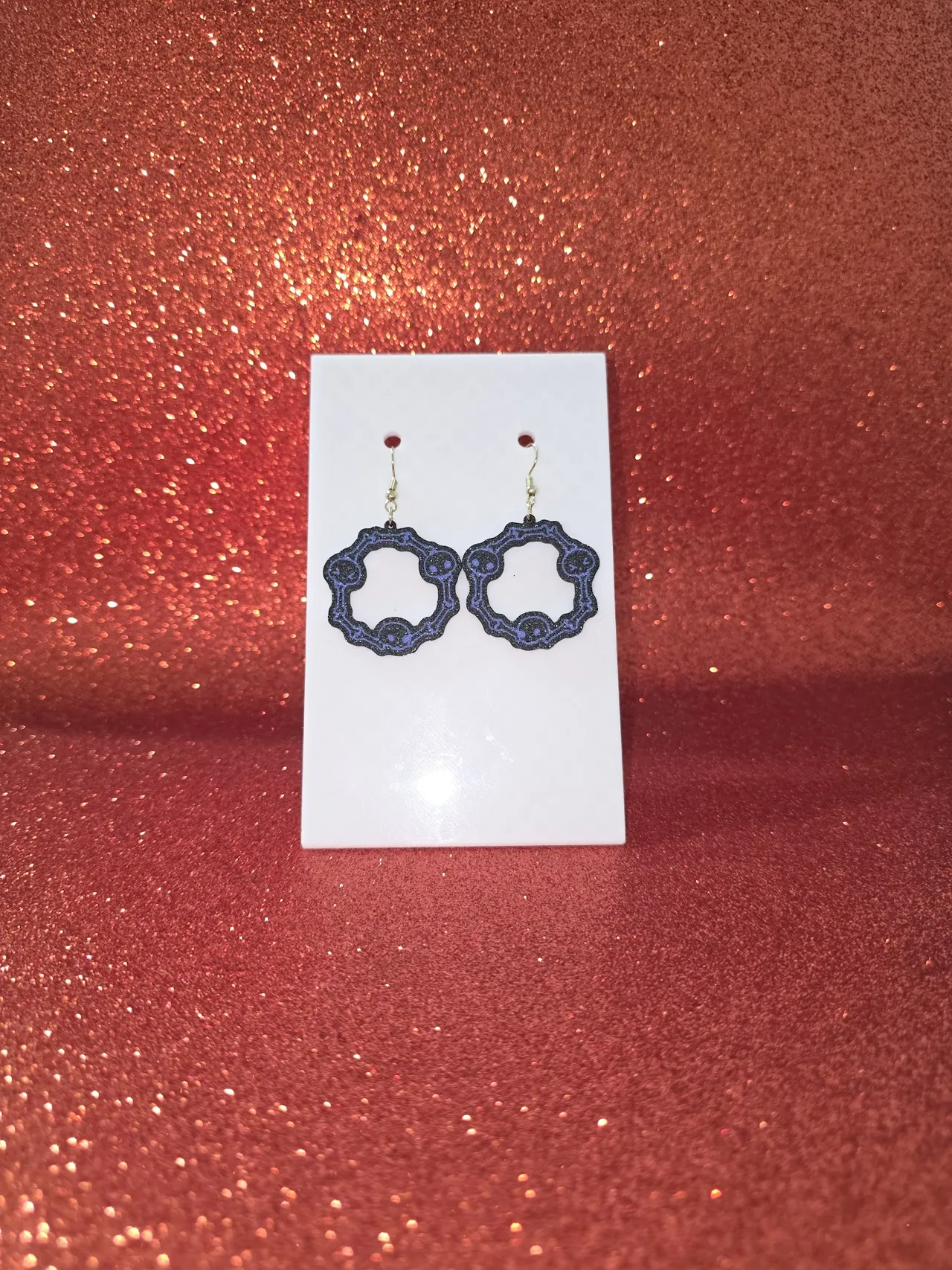 Bones and skulls in a circle earrings view 2