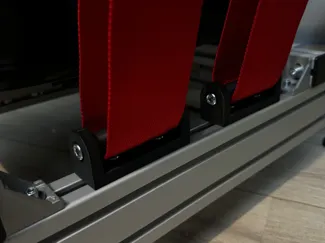Racing simulator seatbelt guide roll