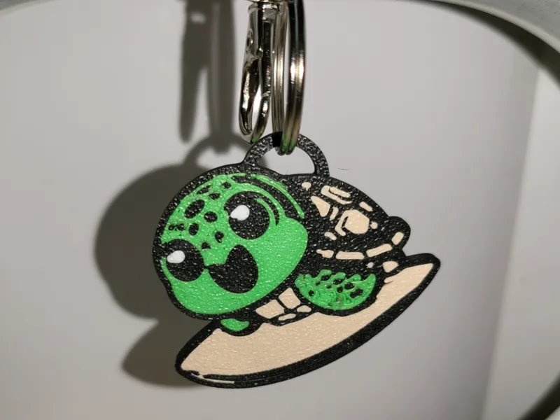 Porte-clés Tortue qui fait du surf 