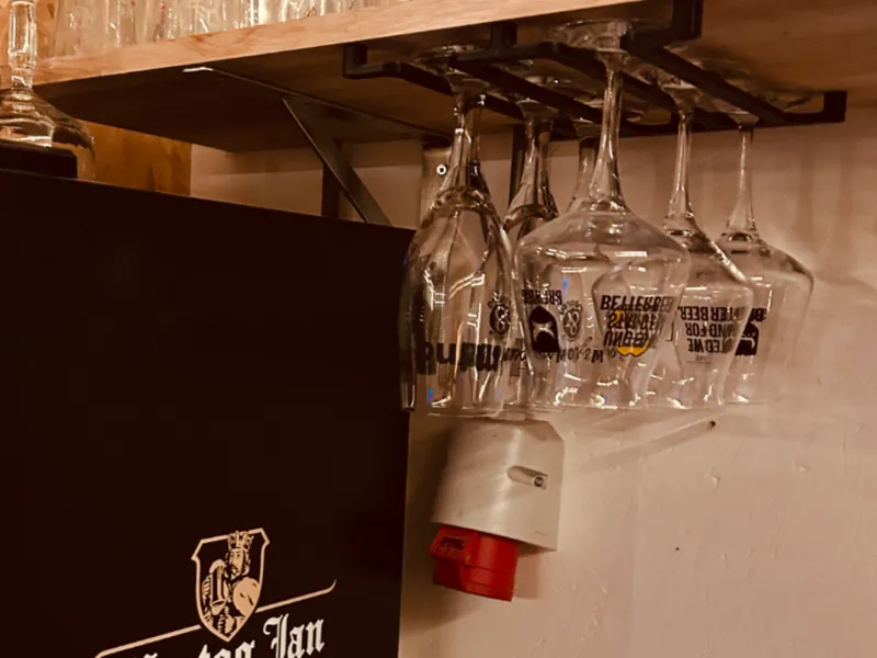 Upside-down wine/beer glass hanging system.