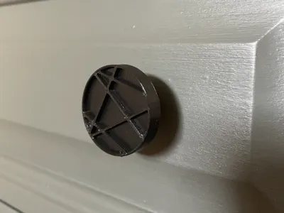 Furniture knob with embossed design