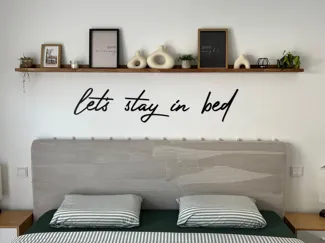 Wall lettering "let's stay in bed"
