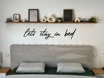 Wall lettering "let's stay in bed"