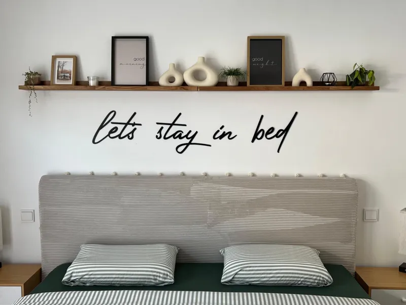 Wall lettering "let's stay in bed"