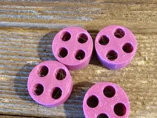 PTFE tube clip with 4 holes.