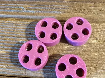 PTFE tube clip with 4 holes.