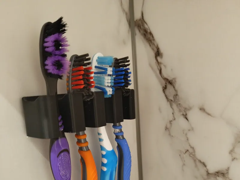 Toothbrush wall holder