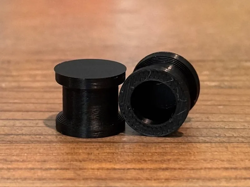Simple plugs, 10 mm or 00 gauge.