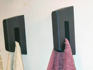 Wall-mounted towel holder with hidden mounting