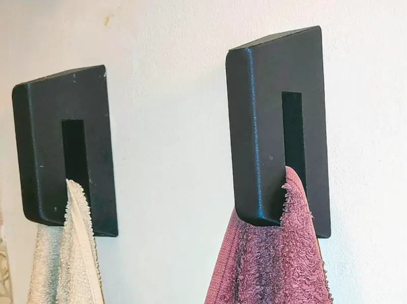 Wall-mounted towel holder with hidden mounting