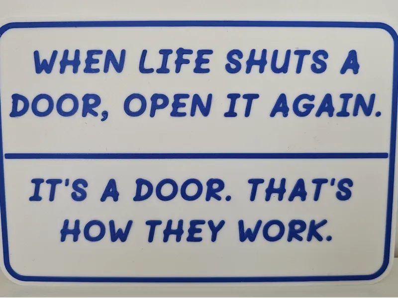 Fun sign when life shuts a door open again NO AMS