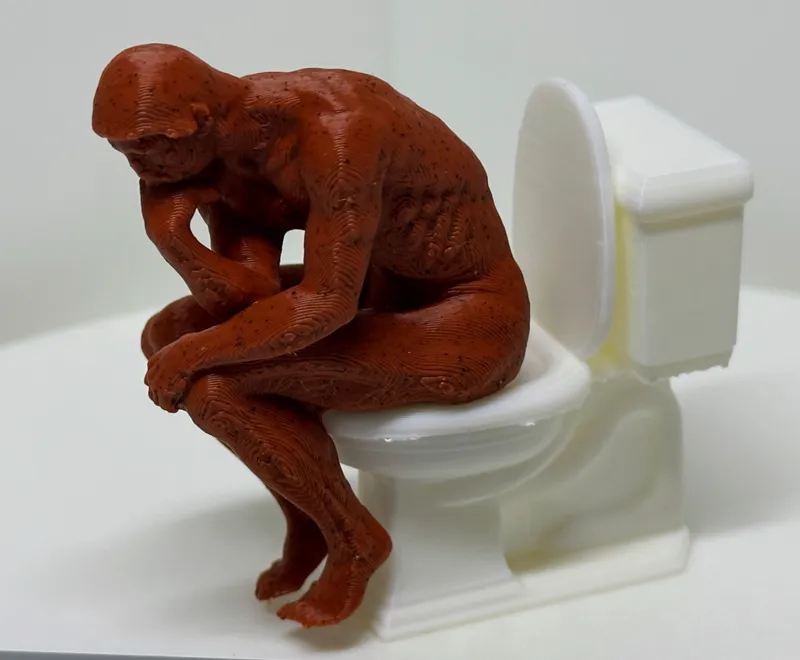 The Stinker Thinker Spinning Man on Toilet