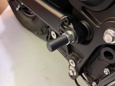 Indian Scout Bobber swingarm bolt cover