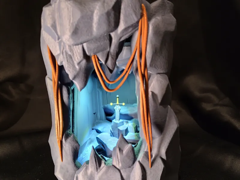 Grotte diorama épée dans le rocher