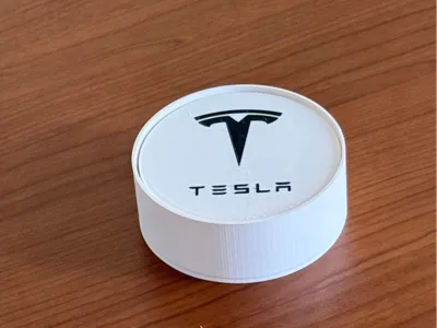 Coasters with Tesla logo and container