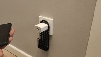 Holder for charging mobile phone for the socket.