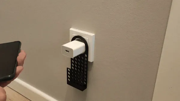 Support téléphone pour prise murale