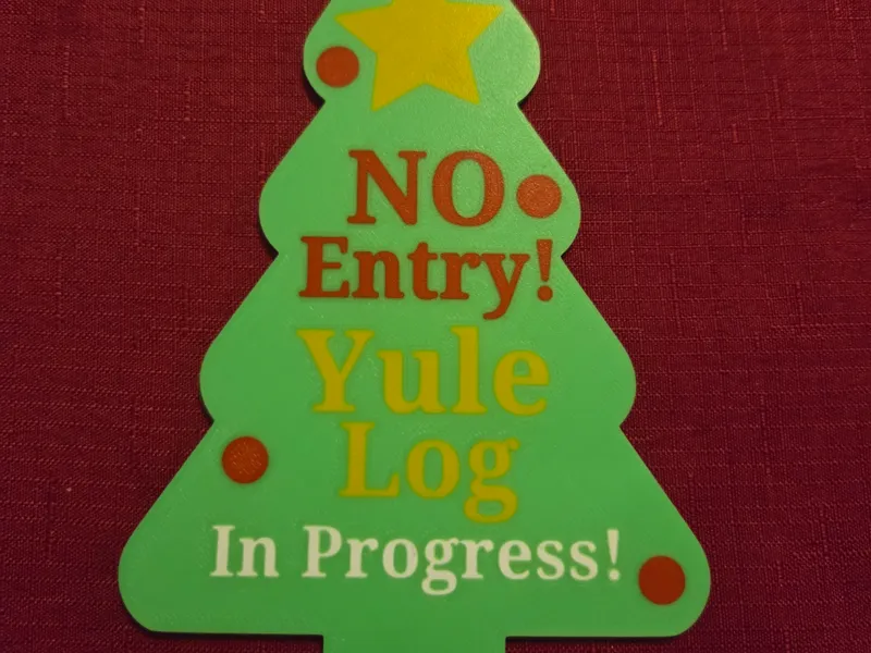 Yule log toilet door sign