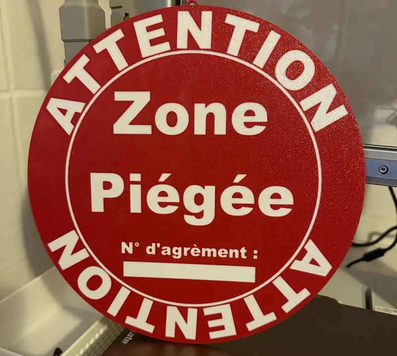 Panneau Attention zone  piégée