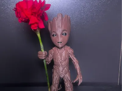 baby groot holder a flower