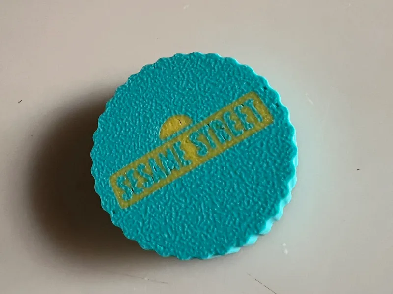 Replacement coin for Elmo's Sing & Learn Playphone