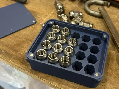 Storage box for wheel nuts